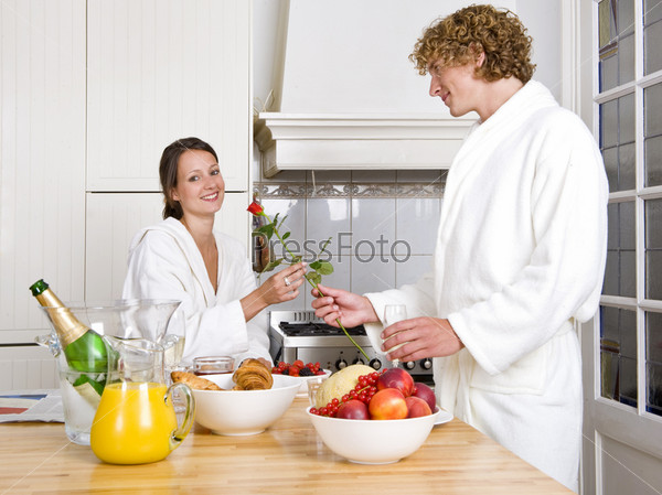 Young couple expressing their love at a valentines champagne breakfast