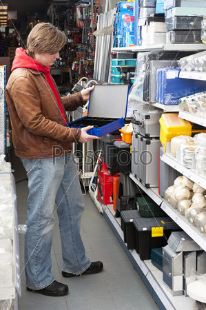 Customer buying a safe deposit box at a hardware store