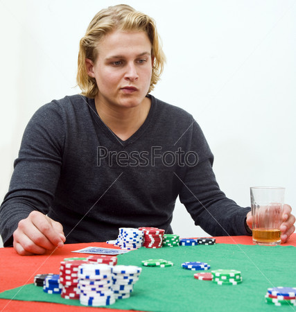 A poker player in deep thought to decide the strategy of his game