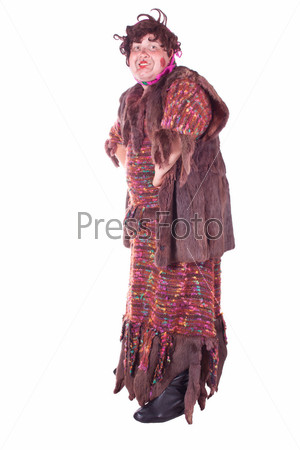 A guy dressed as a witch with a stick. White background. Studio photography.