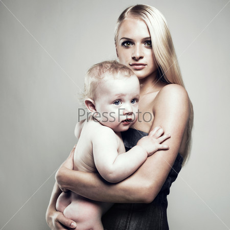beautiful young mom with naked baby