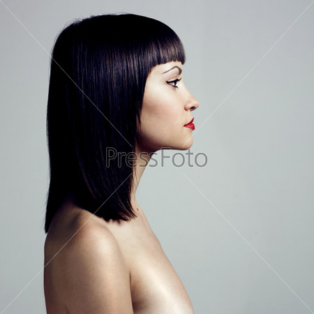Profile of woman with strict hairstyle