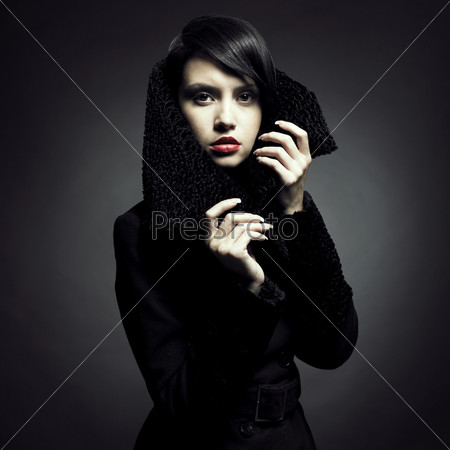 Portrait of a beautiful lady in an elegant coat