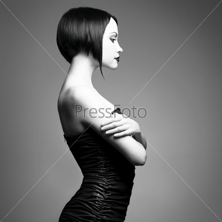 Black and white art photo. Elegant lady with stylish short hairstyle.