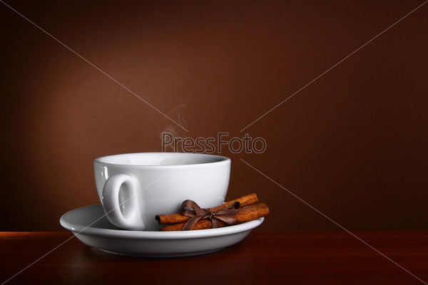 Cup of Hot Coffee with on a wooden table
