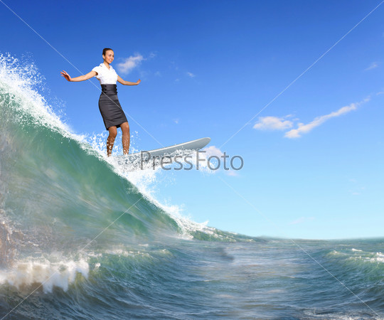 Image of a busineswoman surfing on the sea waves