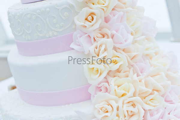 Sweet wedding Cake. Background pink with white flowers
