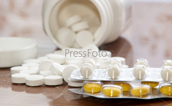 Pills in neutral background, stock photo