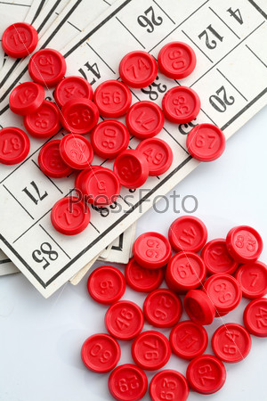 An image of a red bingo game chips on card
