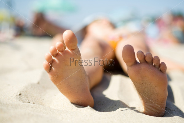 Little feet in the sand, stock photo