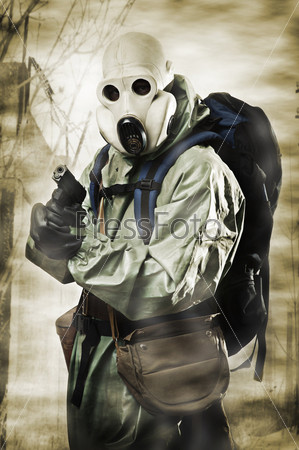 Doomsday. Man in gas mask with gun and backpack