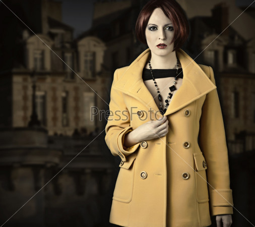 Beautiful young woman in coat