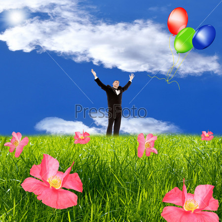 The happy man in a tuxedo starts balloons in the sky