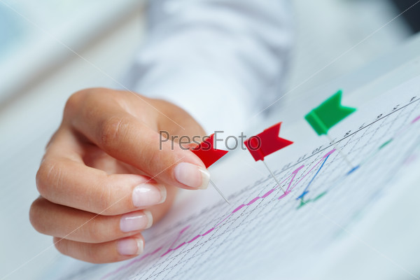 Close-up of business person hand with colorful territory marks