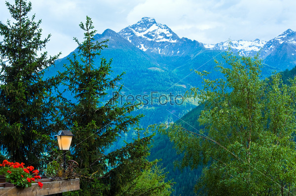 Alps mountains tranquil summer view from terrace. You can to put your sign, logo or lable on lamp.