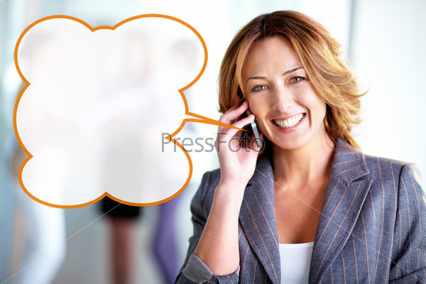 Pretty business woman talking on the phone and looking at camera, useful for ads and leaflets