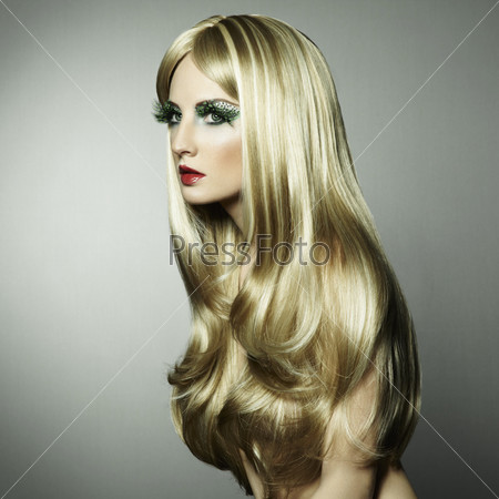 Portrait of a blond woman with long eyelashes. Fashion photo