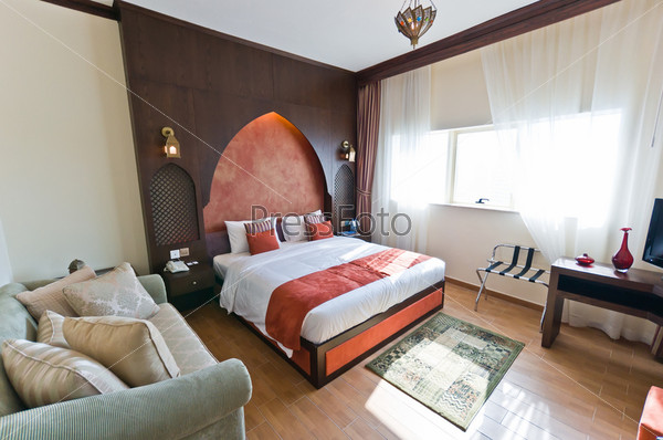 Interior of modern apartment - bedroom in Oriental style, stock photo