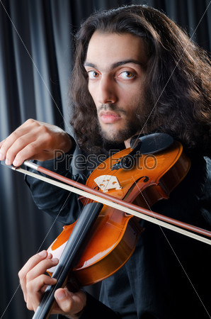 Violin player playing the intstrument, stock photo