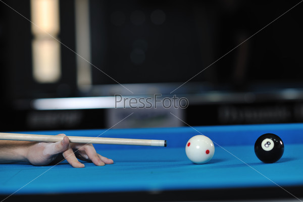 young pro billiard player finding best solution and right angle at billard or snooker pool sport  game