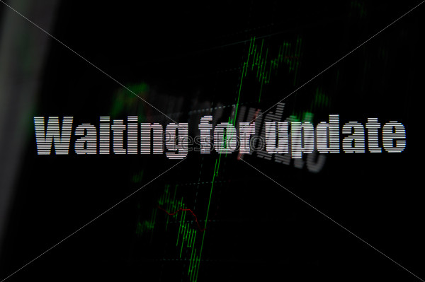 Waiting for update sign on lcd display, stock photo