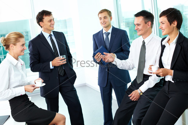 Business people interacting with each other in semi-formal situation