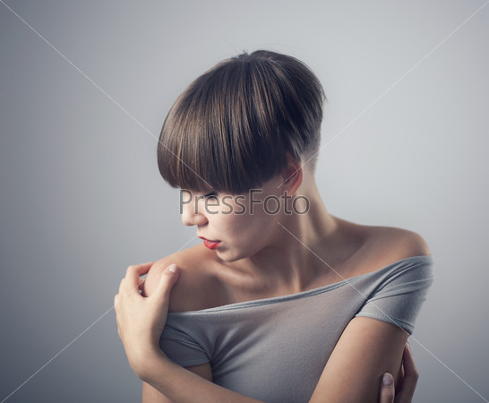 young beautiful woman, posing with the head turned. Doff effect