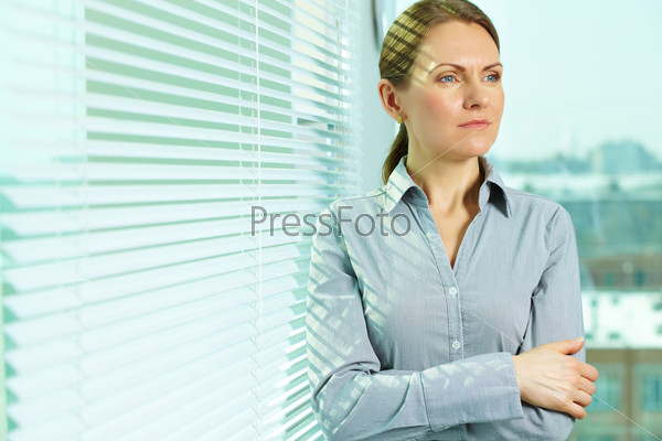 Pretty business lady contemplating about the future of business