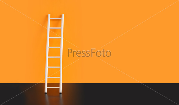 Wooden ladder on black floor against orange wall. Nice background with free space for text