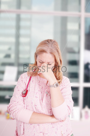 Overburdened doctor at the hospital in the stress, stock photo