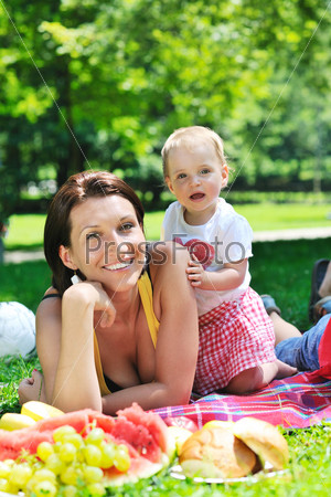 woman and baby playing at park