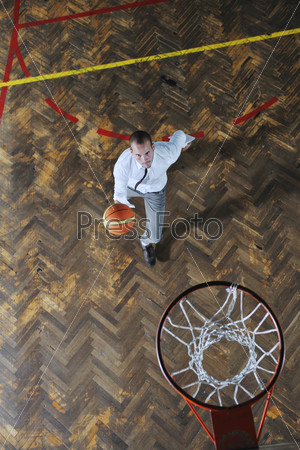 young business man basket player hold basketball ball and representing success and retirement in sport like also sports management concept
