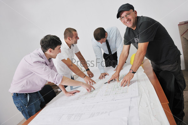 Team of business people in group, architect and engineer  on construction site check documents and business workflow on new building