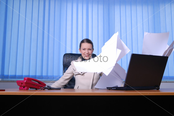 .happy businesswoman throwing papers in air, stock photo