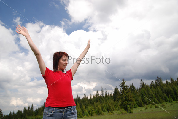 Girl with arms wide open and sky background (Multiple values), stock photo