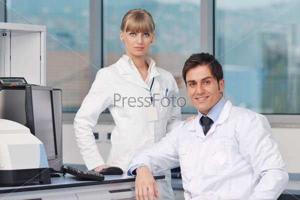 science and research biology chemistry and medicine  young people couple in bright modern  lab