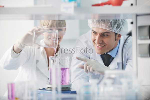 science and research biology chemistry and medicine  young people couple in bright modern  lab