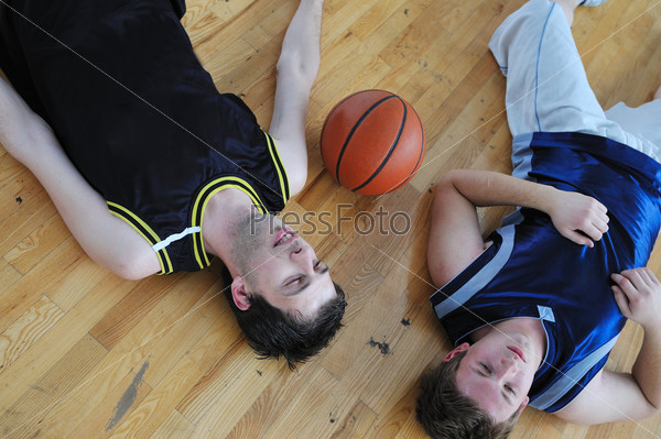 basketball players relax and rest after hard game