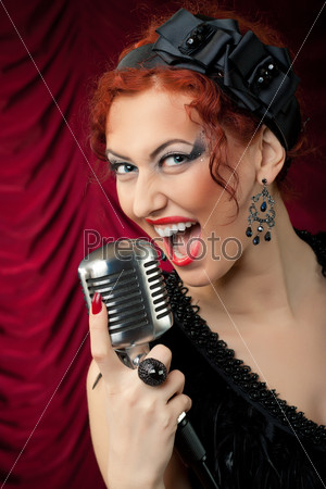 Beautiful redhead woman singing