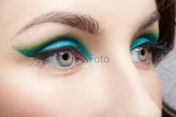 close-up portrait of young beautiful woman eye zone make up