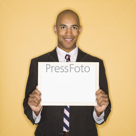 Businessman with blank sign