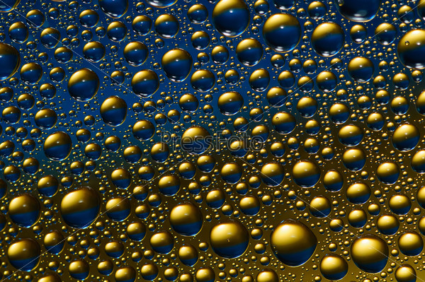 background of blue and gold drops of water