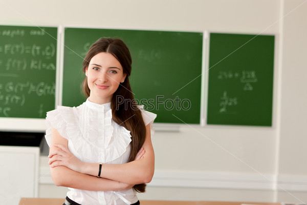 Teacher on background of blackboard
