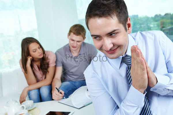Evil real estate agent being glad of palming off a fake contract to his clients