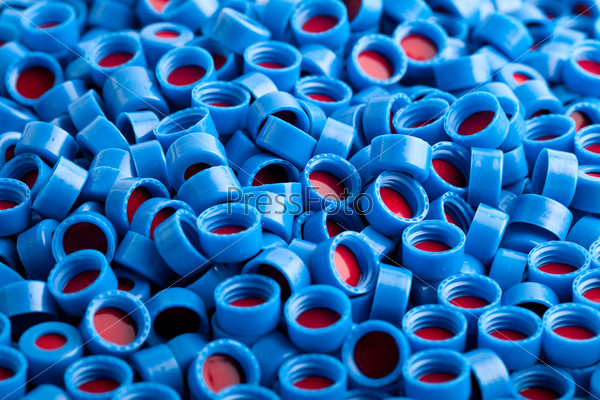 Blue and red plastic caps background