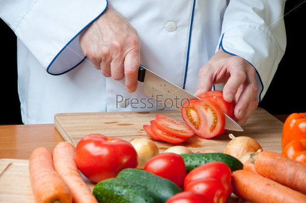 Food preparation Ã¢Â?Â? cutting a fresh tomato