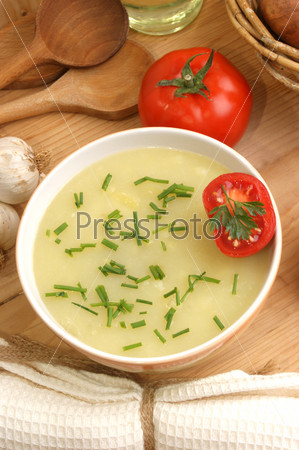 delicious potato soup in a  bowl with tomatoes