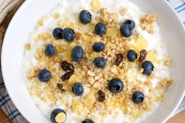 cereal with milk and some fresh organic blueberries