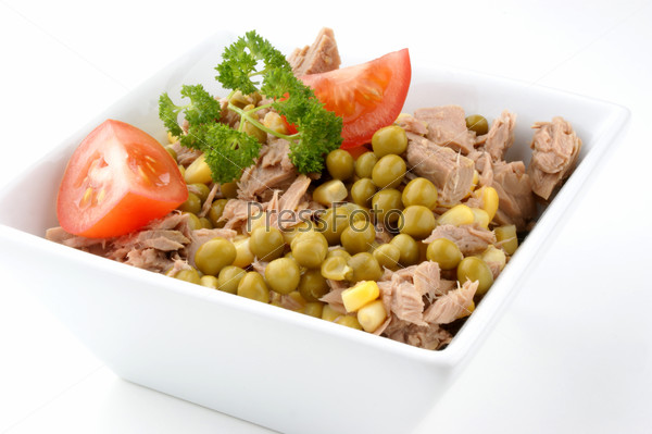 Tuna salad with tomatoes, corn and peas, stock photo