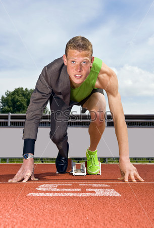 Conceptual image of an athlete (sprinter) ready to start a business career. Performance in business is top sport
